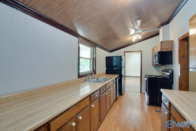 482 Mount Zion Rd, Madison, AL 35757 - kitchen with black appliances, vaulted ceiling, brown cabinetry, crown molding, and light wood-type flooring