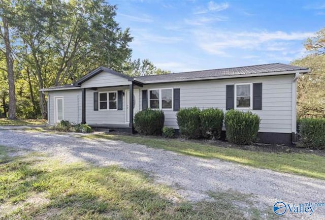 ranch-style house with metal roof