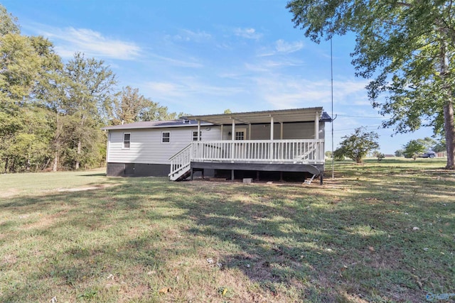 back of property with a wooden deck, a yard, crawl space, and stairs