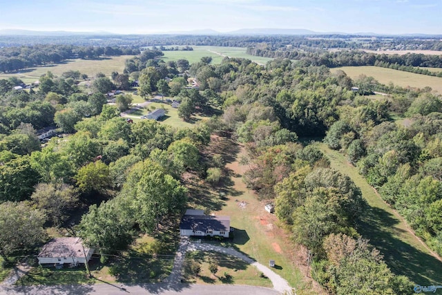 birds eye view of property with a wooded view
