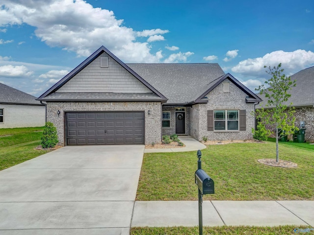 view of front of house featuring a garage and a front lawn