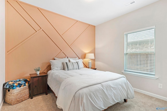 bedroom with light colored carpet