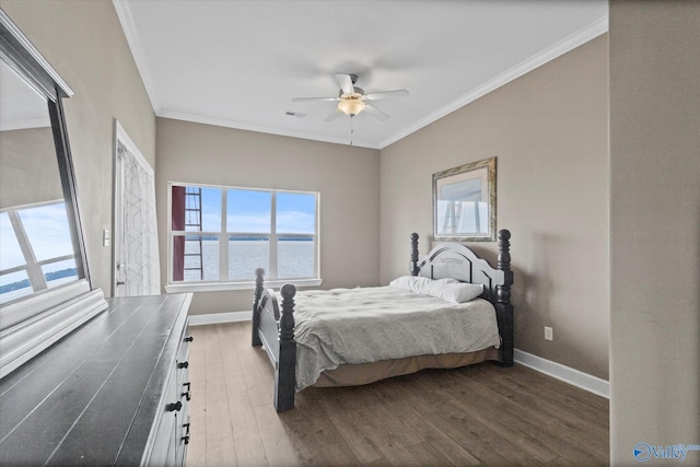 bedroom featuring crown molding, a water view, baseboards, and dark wood finished floors