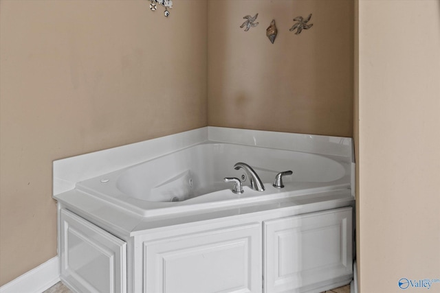 full bathroom featuring a whirlpool tub