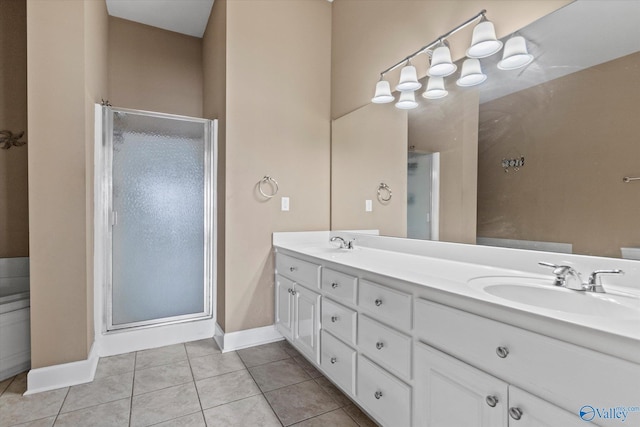 full bath with double vanity, a sink, and a stall shower