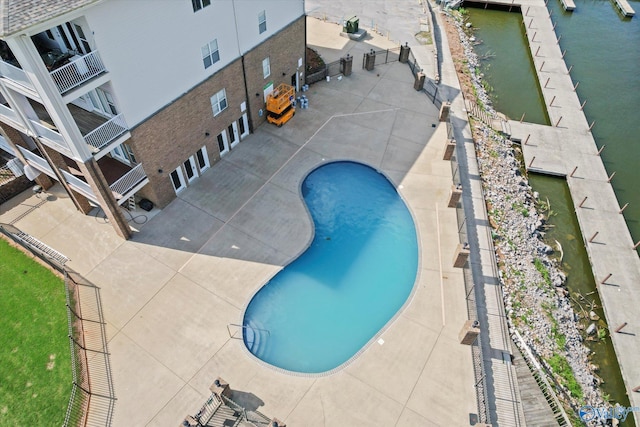 view of pool featuring fence, a fenced in pool, and a patio area