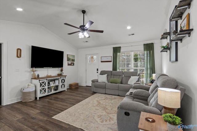 living room featuring crown molding, wood finished floors, lofted ceiling, baseboards, and ceiling fan
