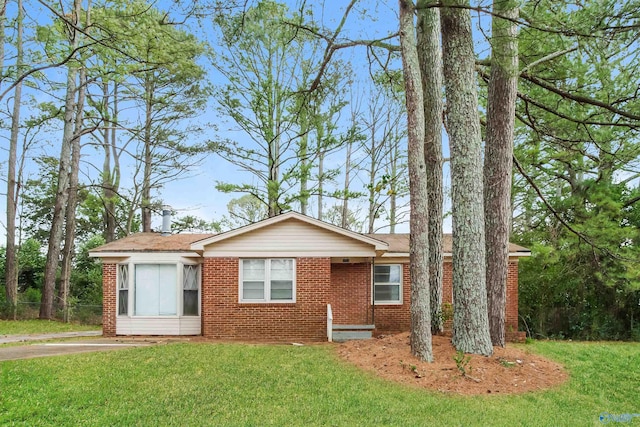 ranch-style home with a front lawn