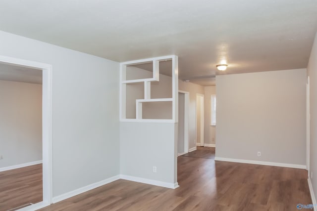 empty room with wood-type flooring