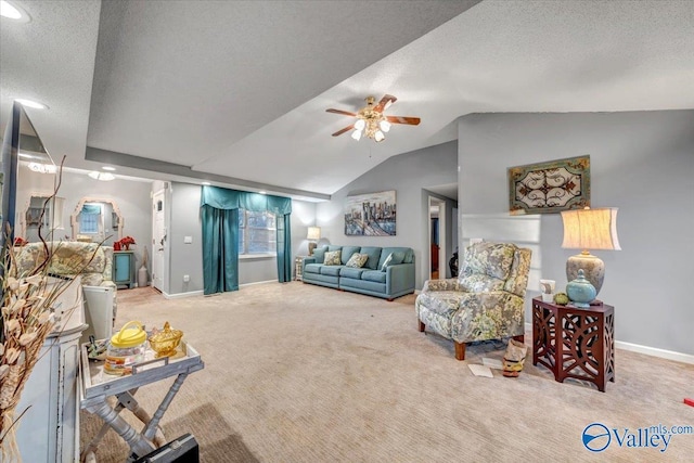 living room with ceiling fan, light colored carpet, vaulted ceiling, and a textured ceiling