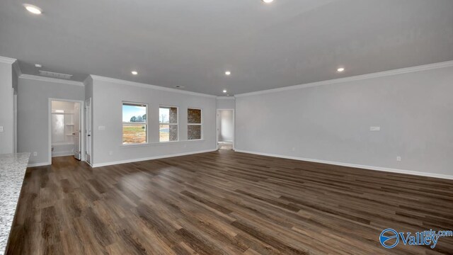 unfurnished living room with dark wood finished floors, baseboards, and recessed lighting