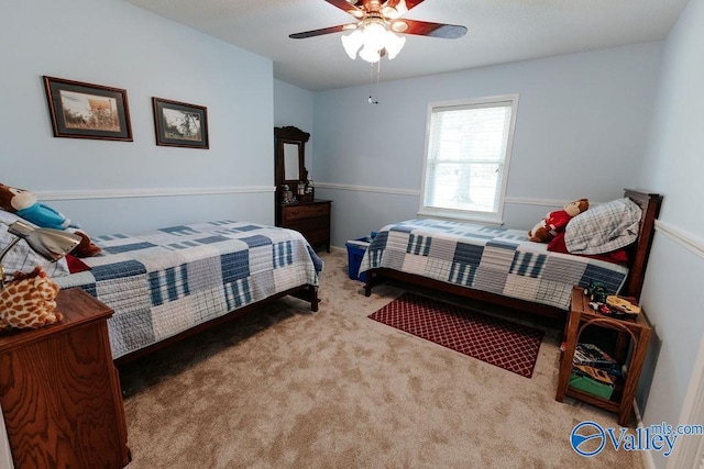 carpeted bedroom featuring a ceiling fan