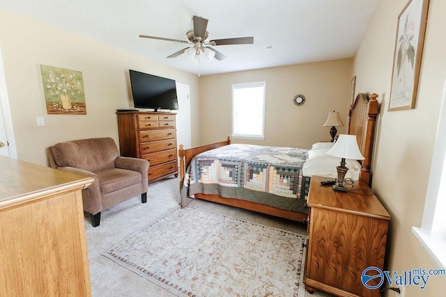 carpeted bedroom with a ceiling fan