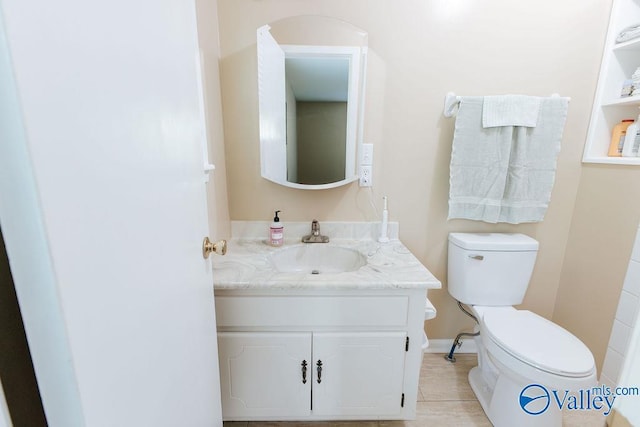 bathroom with toilet and vanity