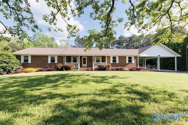 ranch-style home with brick siding, a front lawn, covered porch, and an attached carport