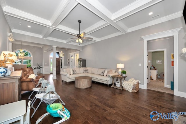 living room featuring beam ceiling, ceiling fan, coffered ceiling, dark hardwood / wood-style flooring, and crown molding