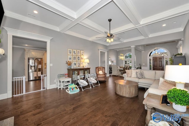 living room with beam ceiling, dark hardwood / wood-style flooring, ceiling fan, and ornamental molding