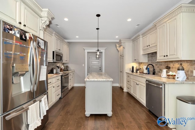 kitchen with pendant lighting, a center island, stainless steel appliances, and dark wood-type flooring