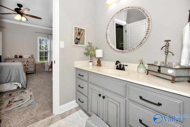 bathroom featuring tile patterned floors, ceiling fan, crown molding, and vanity