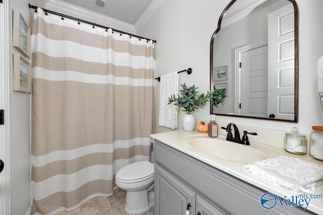 bathroom featuring vanity, toilet, and ornamental molding