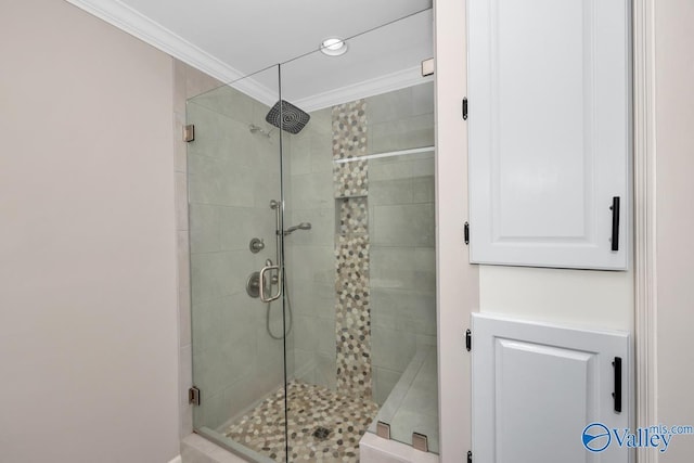 bathroom with a stall shower and ornamental molding