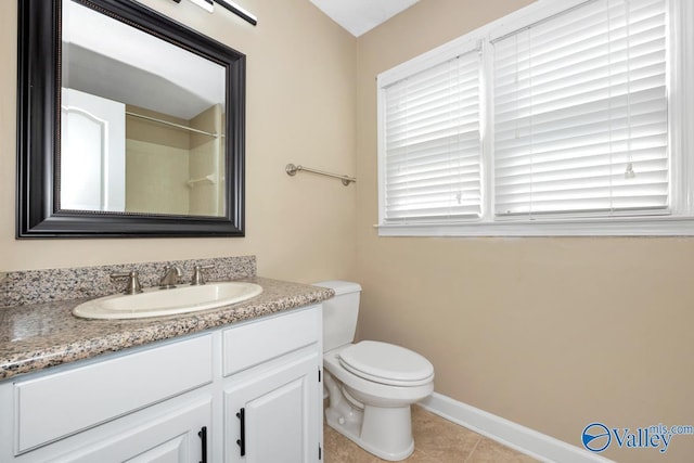 bathroom with vanity, baseboards, a shower, tile patterned floors, and toilet