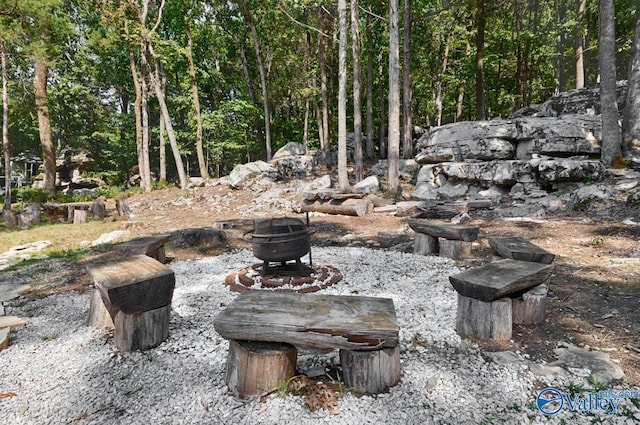 view of patio with an outdoor fire pit