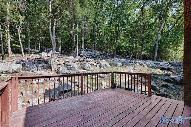 wooden deck featuring a wooded view