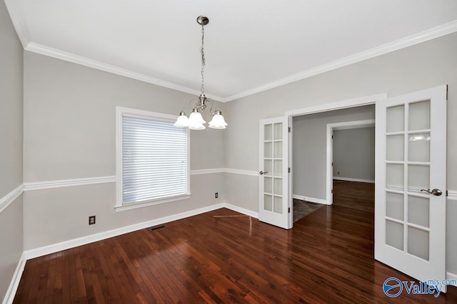 unfurnished dining area featuring visible vents, crown molding, baseboards, and hardwood / wood-style floors