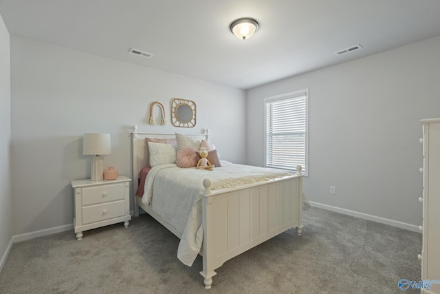 bedroom with light colored carpet, visible vents, and baseboards