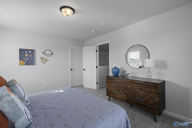 bedroom featuring carpet floors and baseboards