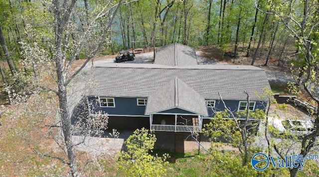 exterior space featuring a view of trees