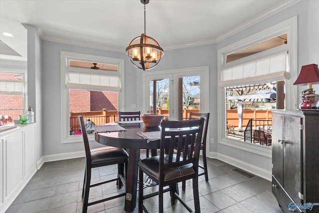 dining room with visible vents, an inviting chandelier, baseboards, and ornamental molding