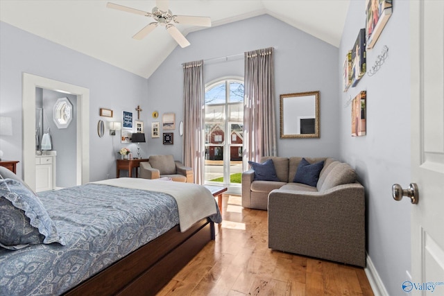 bedroom with baseboards, light wood-type flooring, lofted ceiling, and a ceiling fan