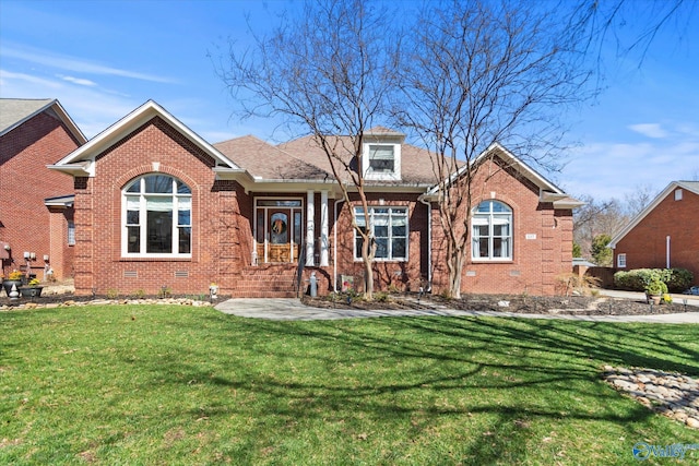 view of front of property featuring brick siding, crawl space, and a front lawn