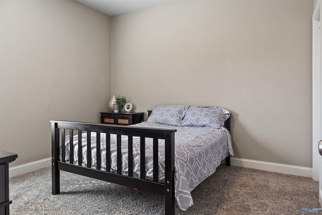 bedroom featuring baseboards and carpet floors