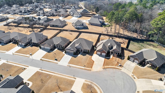 birds eye view of property with a residential view