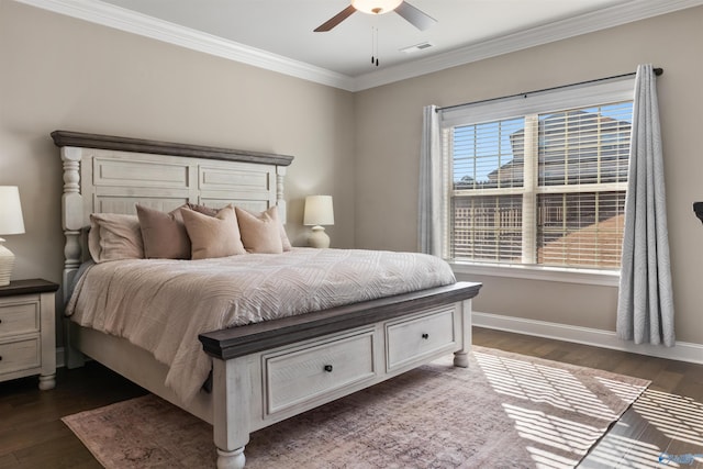 bedroom with visible vents, a ceiling fan, dark wood finished floors, crown molding, and baseboards