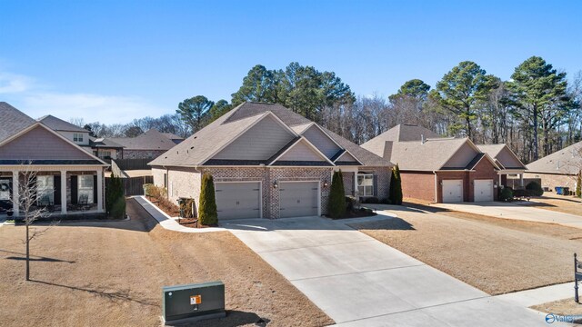 view of front of property with a garage, a residential view, brick siding, and driveway