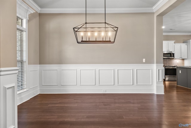 unfurnished dining area featuring dark wood-style flooring and crown molding