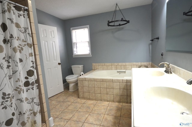 full bathroom with tile patterned flooring, vanity, shower with separate bathtub, and toilet