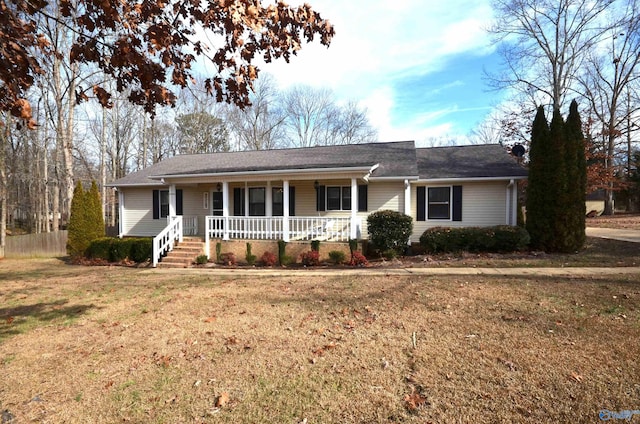 ranch-style home featuring a front yard and a porch