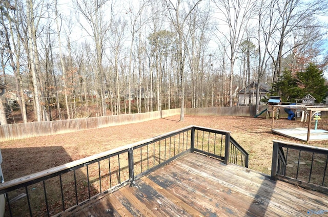 wooden terrace with a playground