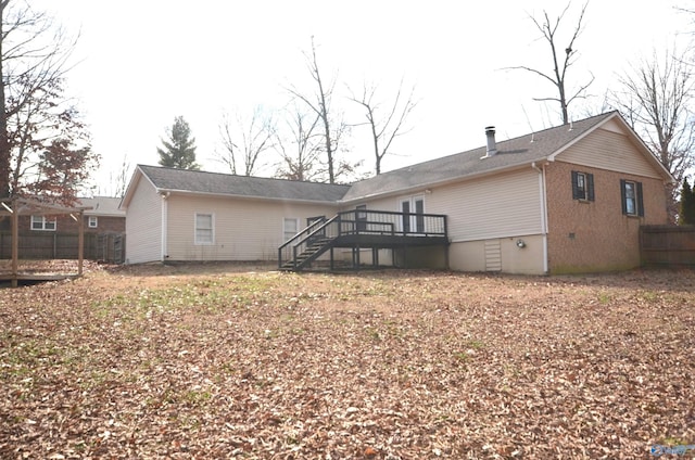 back of property featuring a deck