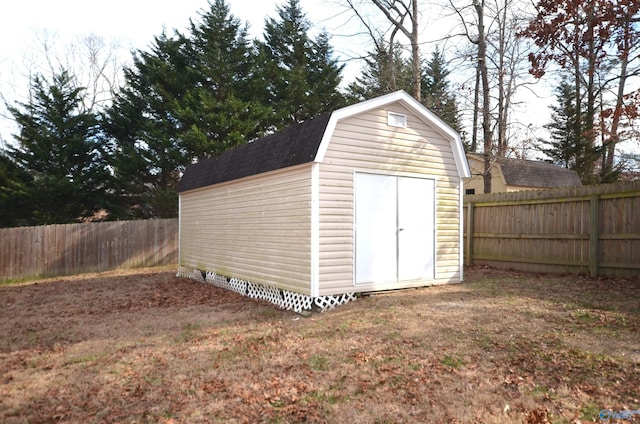 view of outbuilding with a lawn