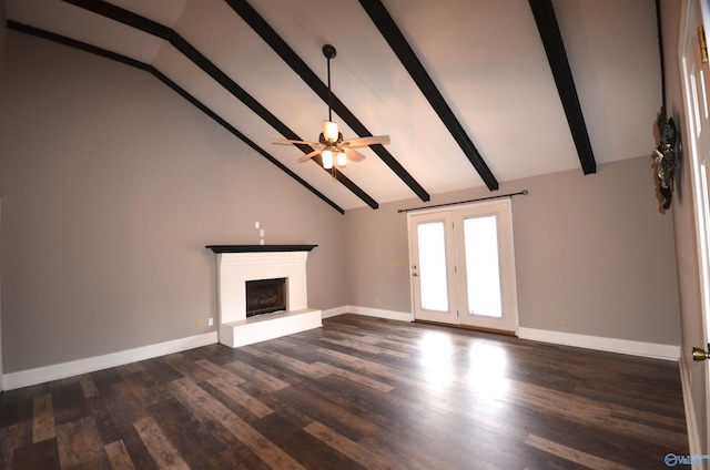 unfurnished living room with ceiling fan, dark wood-type flooring, a fireplace, and beamed ceiling