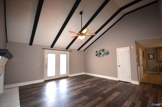 unfurnished living room with dark wood-type flooring, ceiling fan, high vaulted ceiling, a fireplace, and beamed ceiling