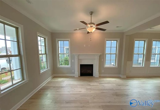 unfurnished living room featuring ornamental molding, light wood-type flooring, and ceiling fan