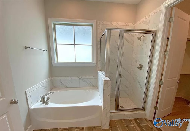 bathroom featuring plus walk in shower