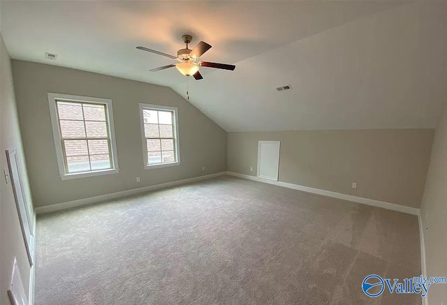 bonus room with ceiling fan, carpet, and lofted ceiling